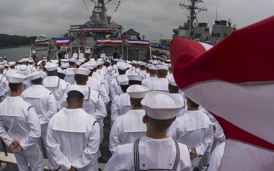 Sailors attend a change-of-command ceremony for the USS John S. McCain aboard the guided-missile destroyer at Yokosuka Naval Base, Japan, Tuesday, July 2, 2019.