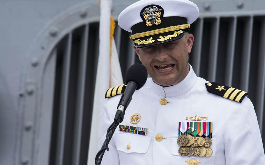 Cmdr. Ryan Easterday speaks after taking command of the USS John S. McCain aboard the guided-missile destroyer at Yokosuka Naval Base, Japan, Tuesday, July 2, 2019.