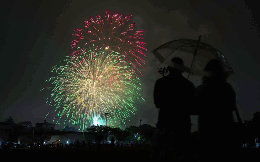 A couple watches the fireworks at Camp Zama, Japan's, Independence Day celebration Saturday, June 29, 2019. 