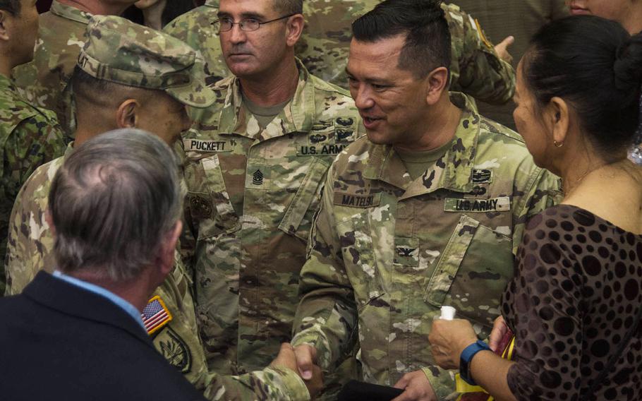 Lt. Col. Lan Dalat greets new U.S. Army Garrison Japan commander Col. Thomas Matelski at Camp Zama, Japan, Wednesday, July 17, 2019. 