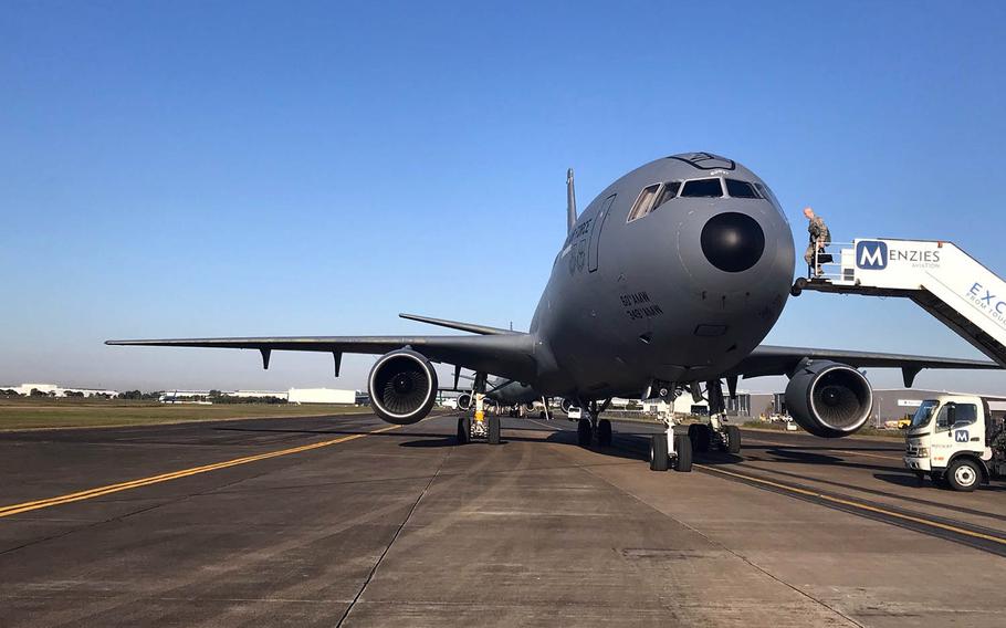 An airman walks aboard a KC-10 Extender at Brisbane International Airport in Australia before a Talisman Sabre air operation, Friday, July 19, 2019.