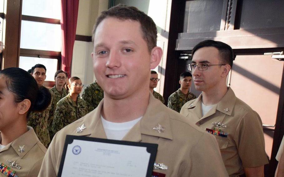 Then-Petty Officer 1st Class Adam Pyron poses during a frocking ceremony at Yokosuka Naval Base, Japan, in early 2019. The promotion was later taken away after he was accused of child rape.