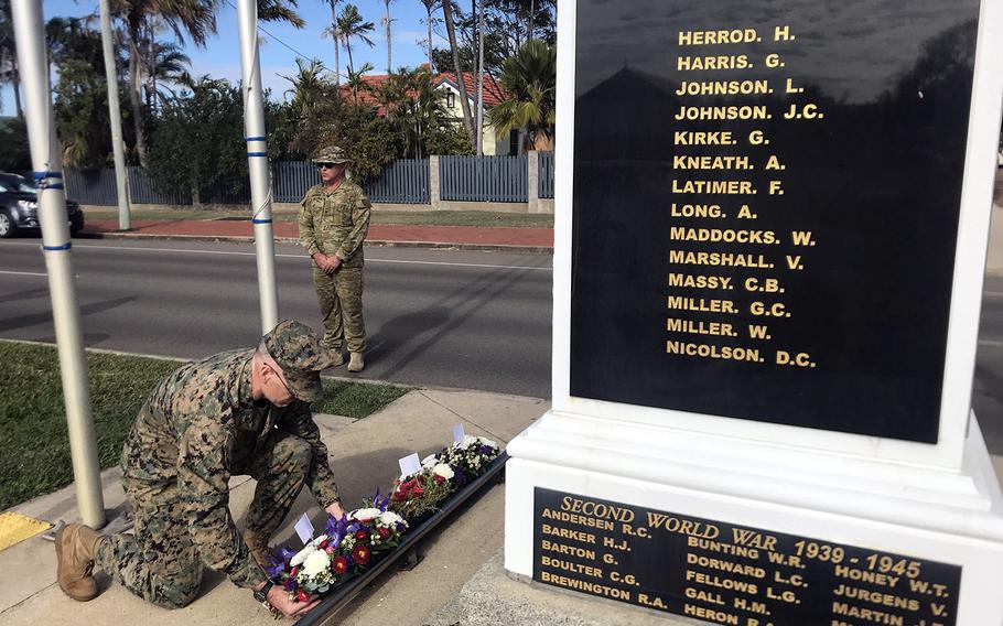 U.S. Marine Col. Matthew Sieber lays a wreath at the Bowen War Memorial, which commorates fallen Australian troops, in Bowen, Australia, Tuesday, July 23, 2019.