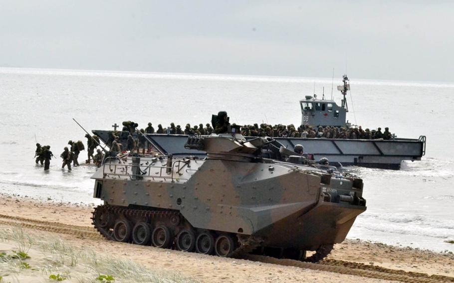 Members of Japan's Amphibious Rapid Deployment Brigade come ashore near Bowen, Australia, during Talisman Sabre 2019 on Monday, July 22, 2019.