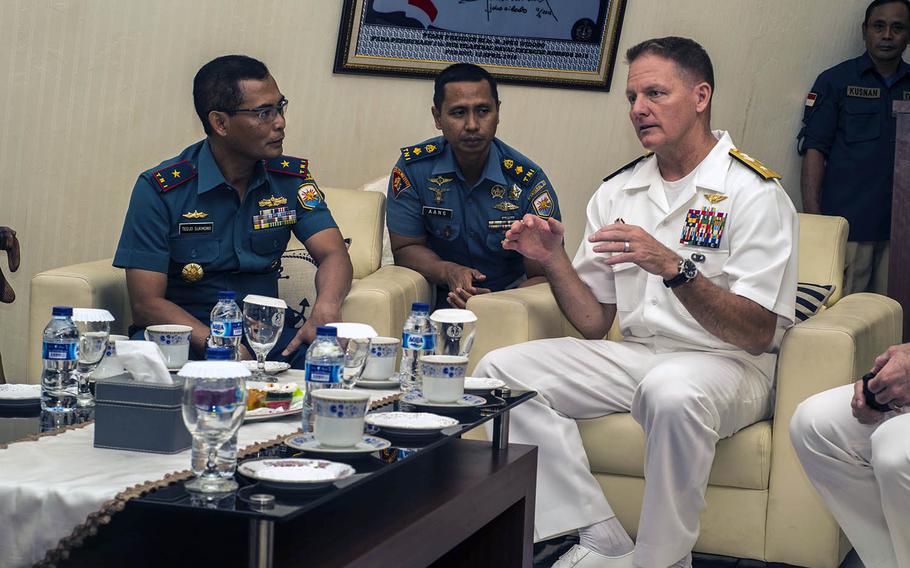 Rear Adm. Joey Tynch, right,  commander, Logistics Group Western Pacific, and Indonesian navy First Adm. Tedjo Sukmono hold an office call during Cooperation Afloat Readiness and Training Indonesia on Aug. 2, 2019.