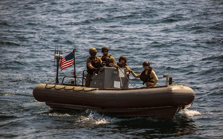 Sailors from USS Montgomery conduct a visit, board, search and seizure exercise in the Java Sea as part of Cooperation Afloat Readiness and Training Indonesia on Aug. 6, 2019.