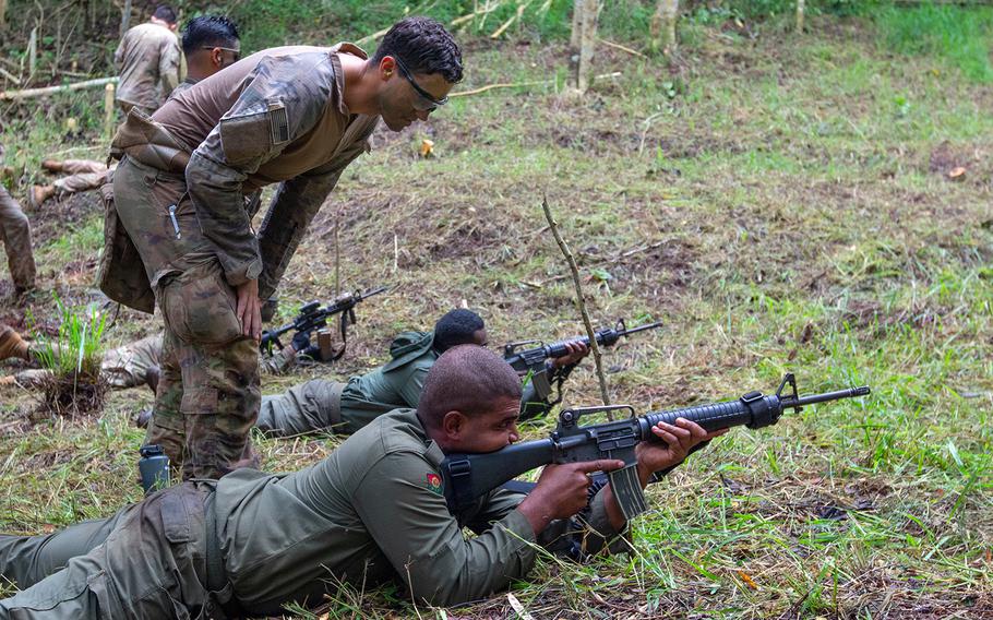 Army Sgt. Tanner Bianchi observes a Fijian soldier during training in Labasa, Fiji, July 31, 2019.