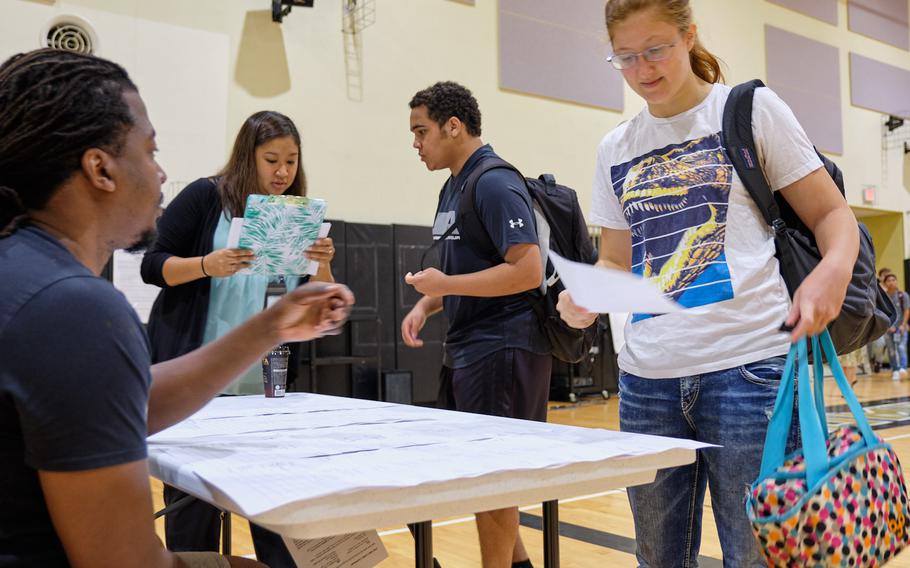 Seniors report to the gym to receive their class schedules at Humphreys High School on Camp Humphreys, South Korea, Monday, August 26, 2019.