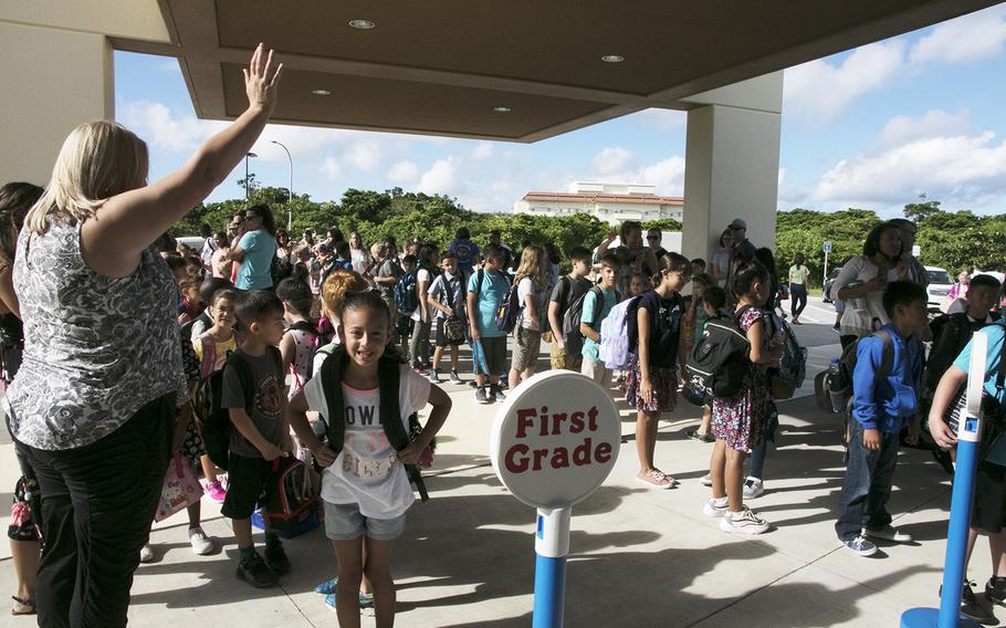 Students line up in front of Kadena Elementary School on Okinawa for the first day of classes, Monday, Aug. 26, 2019.