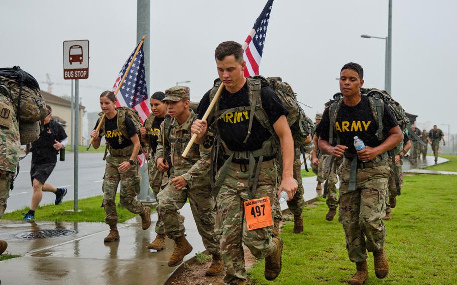 Soldiers from across South Korea participate in the 9/11 Memorial Ruck March at Camp Humphreys, South Korea, Wednesday, Sept. 11, 2019.