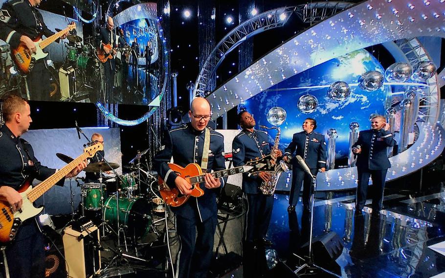 Members of the U.S. Air Force Band of the Pacific — from left, Master Sgt. Josh Holdridge, Staff Sgt. Andrew Clemenson, Senior Airmen Pete Somerville, Derrick Newbold and Alycia Cancel and Master Sgt. Christin Foley — perform on a live broadcast of the Japanese TV show, "Nodojiman The World!" in Tokyo on Wednesday, Sept. 11, 2019.