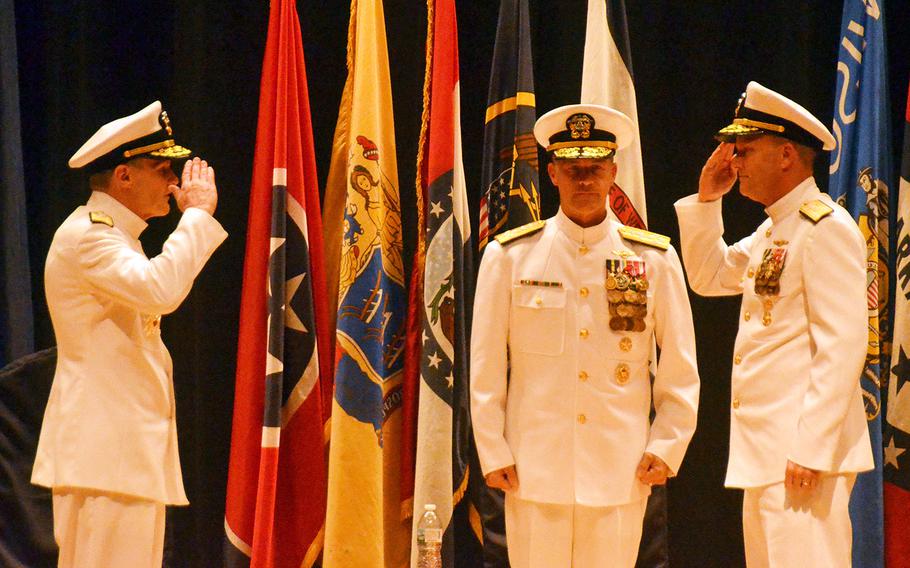Outgoing 7th Fleet commander Vice Adm. Phillip Sawyer, left, salutes his replacement, Vice Adm. Bill Merz, far right, during their change-of-command ceremony at Yokosuka Naval Base, Japan, Thursday, Sept. 12, 2019. Pacific Fleet commander Adm. John Aquilino stands between them.