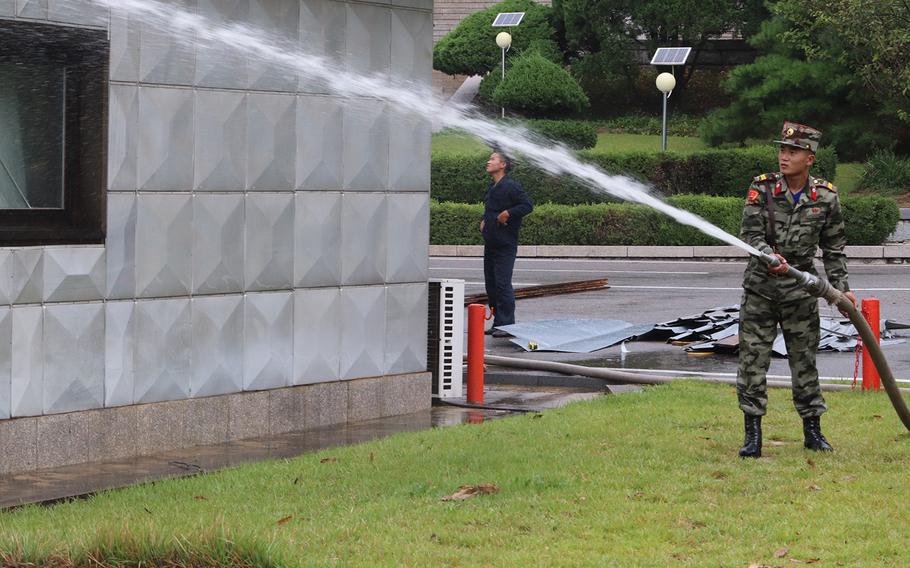 North Korean soldiers and workers repaired typhoon damage at the Joint Security Area on the border from Sept. 12-14, 2019.