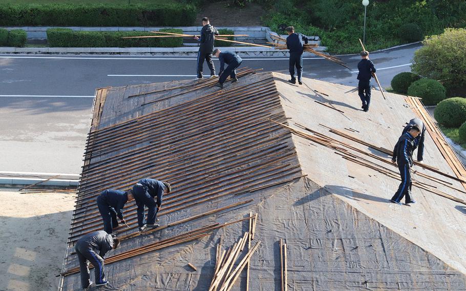 North Korean soldiers and workers repaired typhoon damage at the Joint Security Area on the border from Sept. 12-14, 2019.