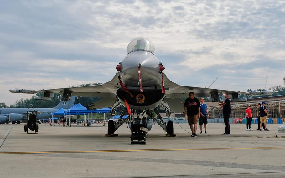 Visitors check out an F-16 Fighting Falcon during Air Power Day at Osan Air Base, South Korea, Friday, Sept. 20, 2019.