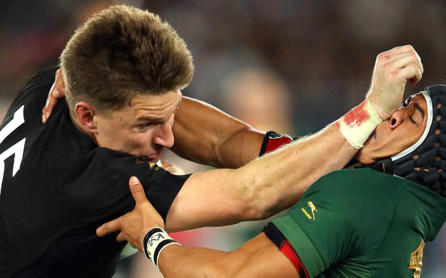 All Black Beauden Barrett bashes Springbok Cheslin Kolbe's nose during a Rugby World Cup match at International Stadium Yokohama, Saturday, Sept. 21, 2019.