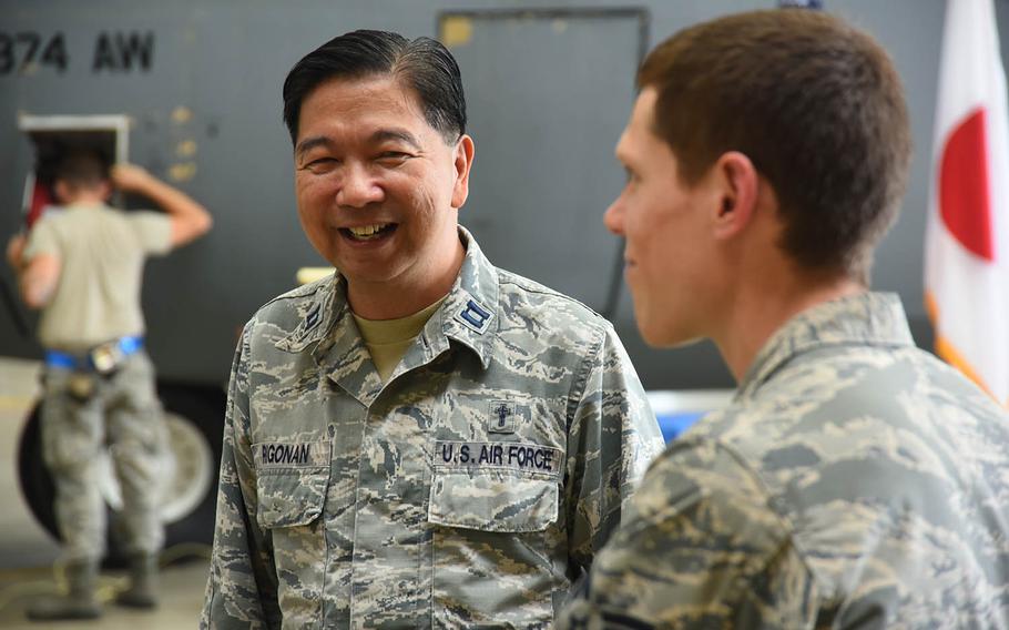For the past year, Chaplain (Capt.) Antonio Rigonan, left, a Catholic priest from New York, has worked two days a week inside a hangar at Yokota Air Base, Japan.