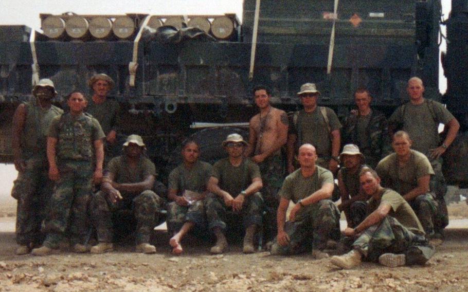 U.S. Eagles national rugby team manager Oscar Alvarez, seated at center wearing a hat and sunglasses, is a Marine Corps veteran who joined up in 1999 and was part of the invasion of Iraq in 2003 as a member of the Camp Pendleton, Calif.-based Marine Aviation Logistics Squadron 39.