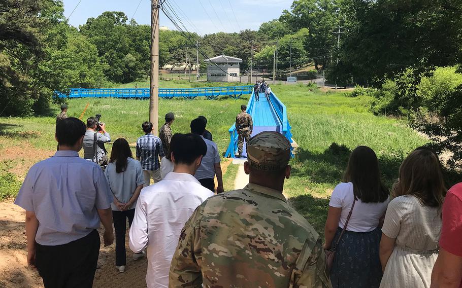 A group waits to tour a walking bridge on the South Korean side of the Joint Security Area at the border with North Korea in May 2019.