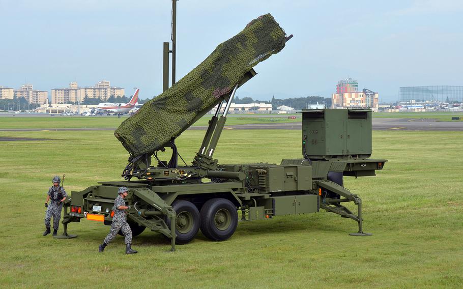 Members of the Japan Air Self-Defense Force set up a Patriot missile-defense battery at Yokota Air Base, Japan, during a demonstration in August 2017.
