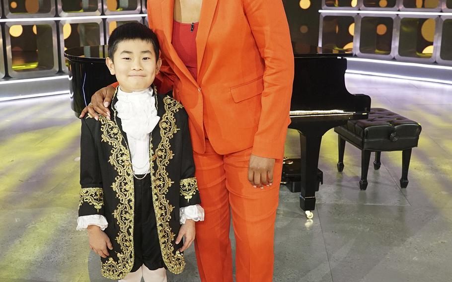 Hayden Lee, 9, a student at Zukeran Elementary School on Camp Foster, Okinawa, poses with "Kids Say the Darndest Things" host Tiffany Haddish after taping the show over the summer in Los Angeles.