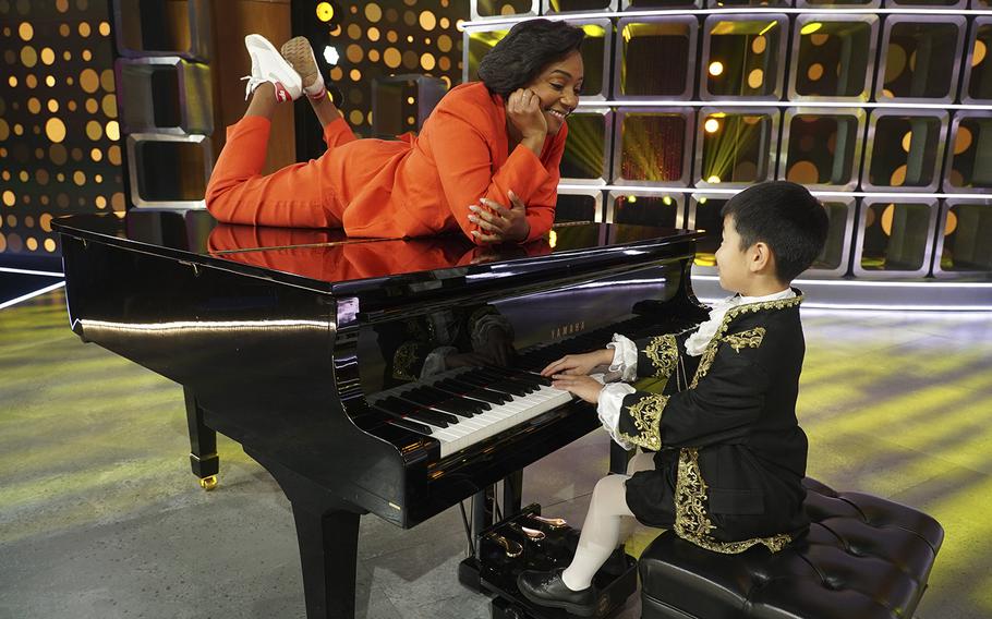 Hayden Lee, 9, a student at Zukeran Elementary School on Camp Foster, Okinawa, performs for "Kids Say the Darndest Things" host Tiffany Haddish while taping the show in Los Angeles over the summer.