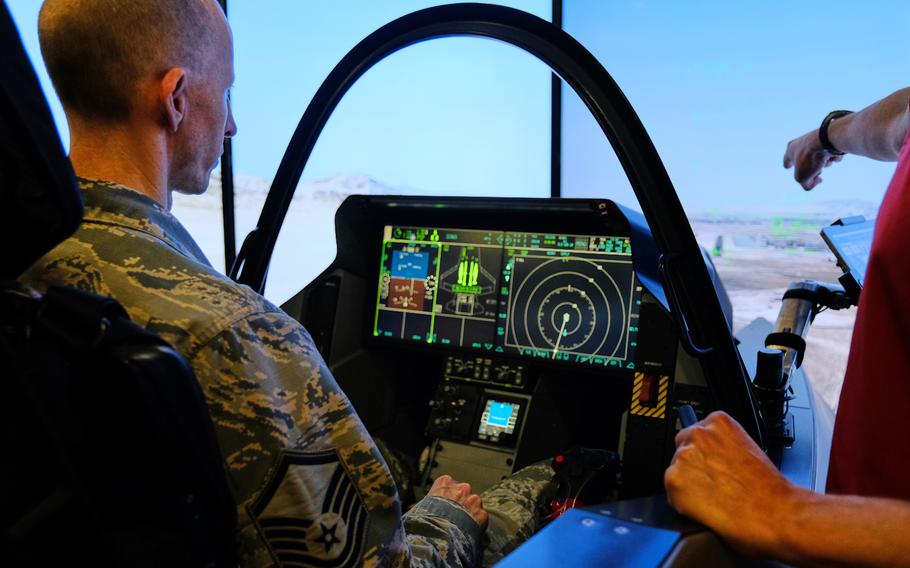 Master Sgt. David Snowman of the 51st Fighter Wing tries out an F-35 Lightning II simulator at Osan Air Base, South Korea, Thursday, Oct. 24, 2019.