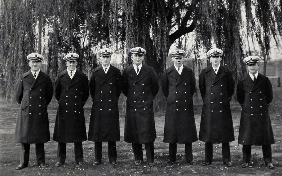 Thomas Crotty stands second from left among a group of fellow Coast Guard members in this undated photo provided by the Defense POW/MIA Accounting Agency.