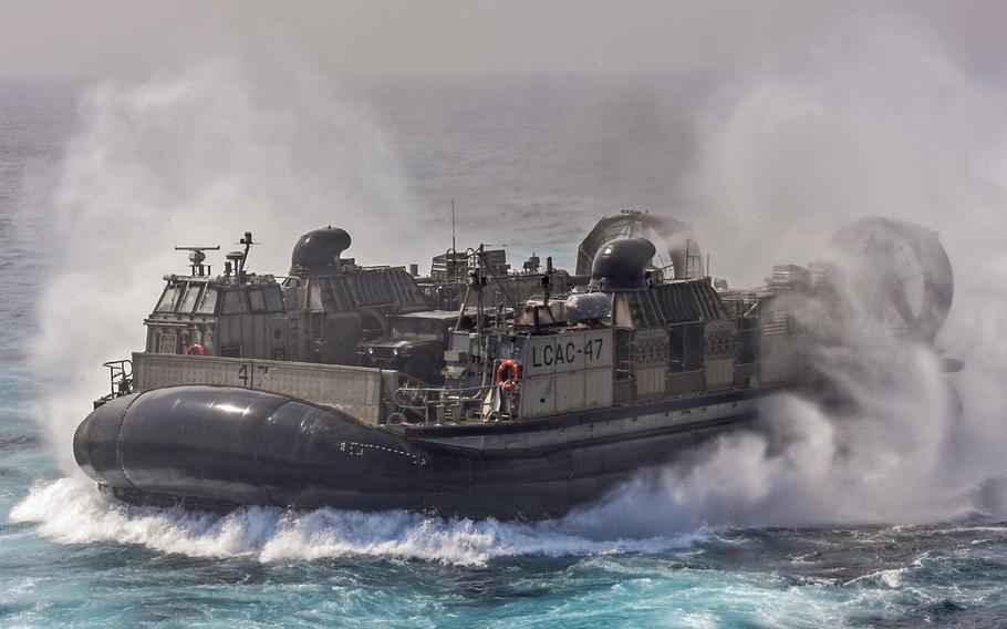 A landing craft assigned to Naval Beach Unit 7 transits from the dock landing ship USS Germantown during exercise Tiger Triumph, in the Bay of Bengal, India, on Nov. 17, 2019.