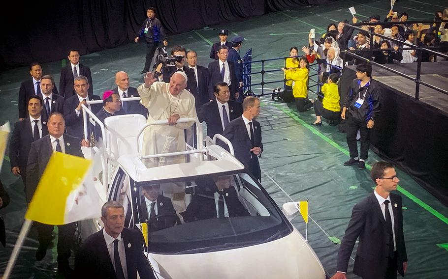 Pope Francis  greets a crowd of 55,000 at the Tokyo Dome, Japan, gathered for Mass on Monday, Nov. 25, 2019.