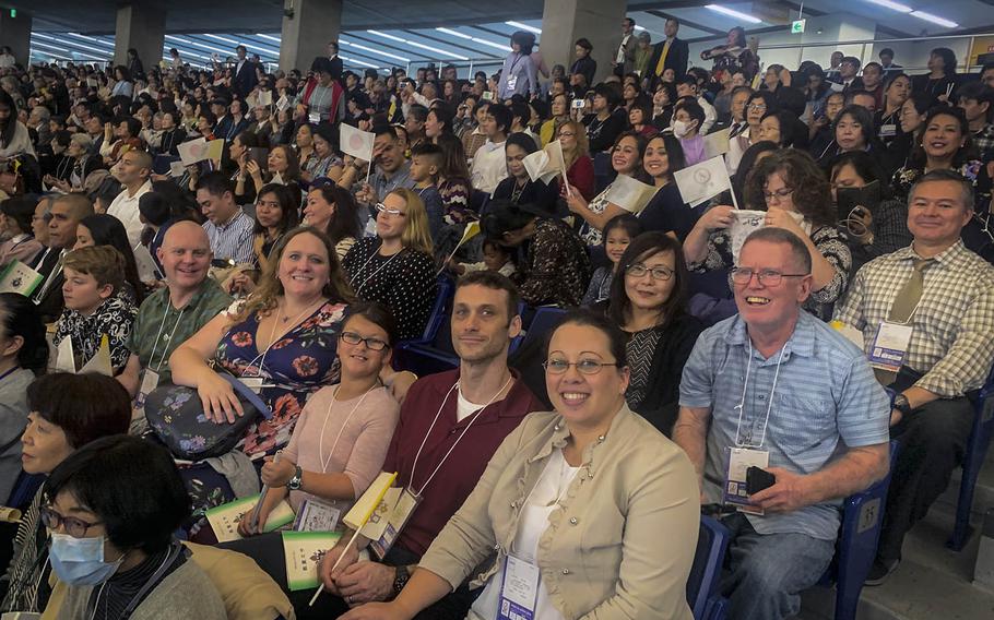 A group of 49 Catholics from Yokosuka Naval Base await Pope Francis' arrival in the Tokyo Dome, Japan, on Monday, Nov. 25, 2019.