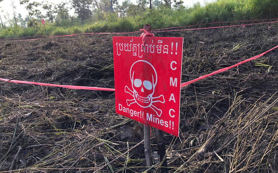 A warning sign marks the edge of a suspected minefield in the countryside north of Siem Reap, Cambodia, on Nov. 6, 2019.