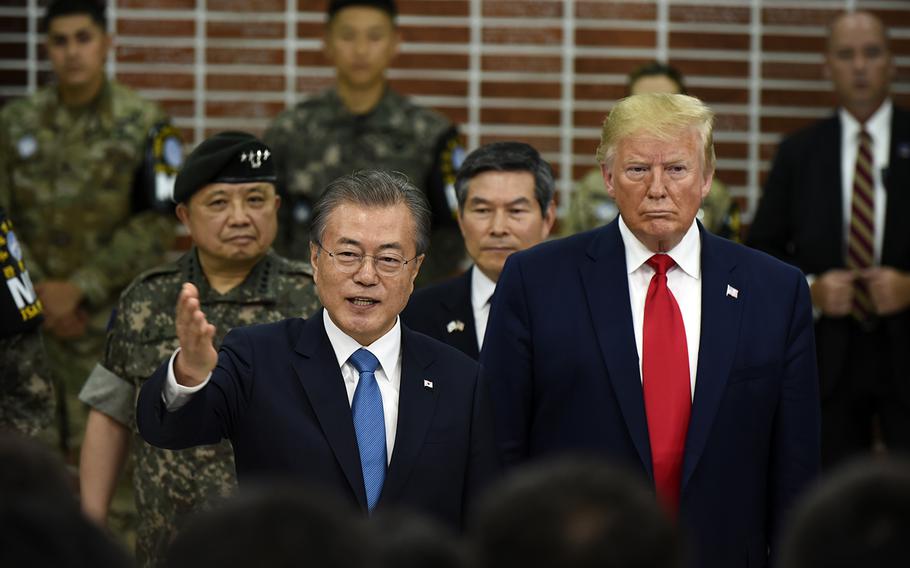 President Donald Trump and South Korean President Moon Jae-in speak with soldiers stationed at the Joint Security Area between the two Koreas, June 30, 2019.