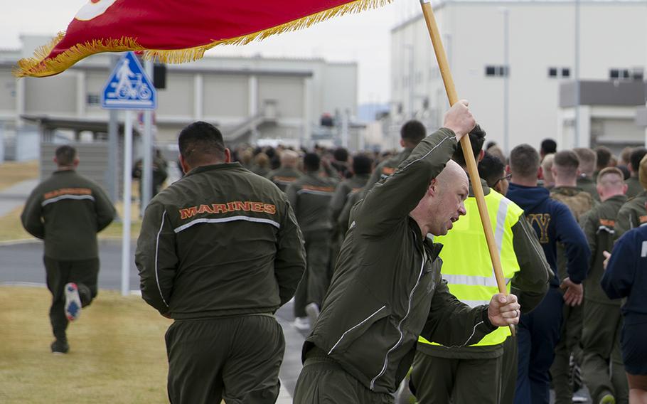 Marines with Marine Aerial Refueler Transport Squadron 152 participate in a memorial run at Marine Corps Air Station Iwakuni, Japan, Dec. 5, 2019. The event honored  five Marine aviators killed last year in a midair collision off Japan.