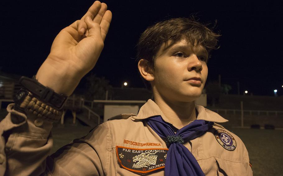 Ian Clingan, a Life Scout with the Scouts BSA Troop 110, does the Scout Sign during a meeting at Camp Courtney, Okinawa, Wednesday, Dec. 18, 2019.
