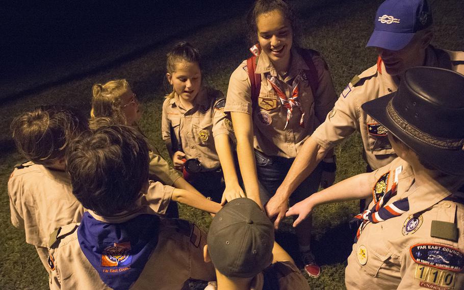 Members of the Scouts BSA Troop 110 huddle after a meeting at Camp Courtney, Okinawa, Wednesday, Dec. 18, 2019.