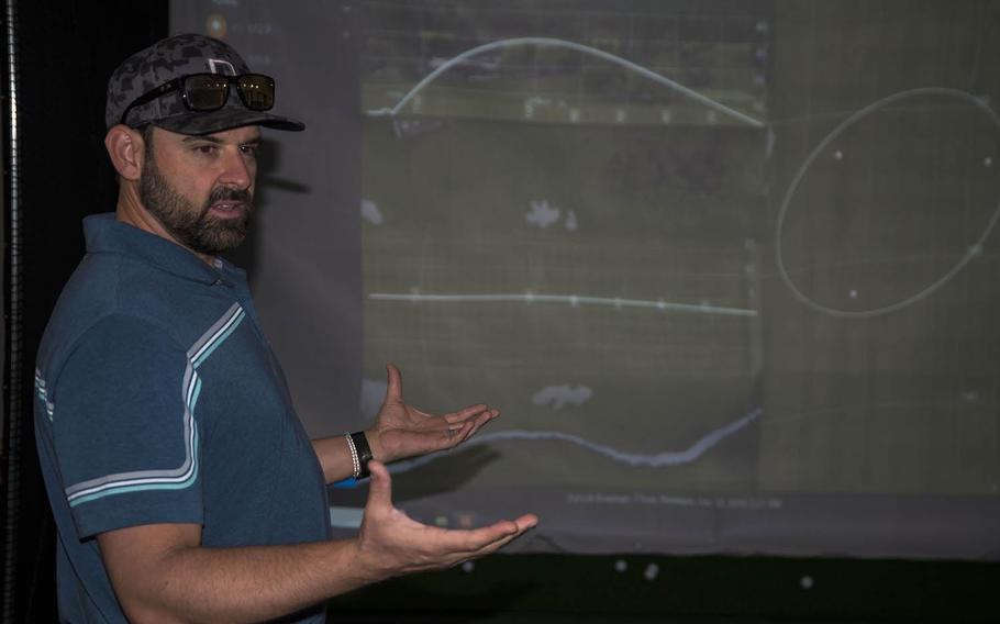 Patrick Bowman, the golf pro at the Yokota Air Base Par 3 Golf Course, Tokyo, Japan, explains how the new Trackman simulator can improve a player's game on Dec. 13, 2019.