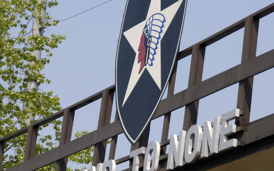 A sign depicts the 2nd Infantry Division's patch and motto at Camp Casey, South Korea, in April 2015.