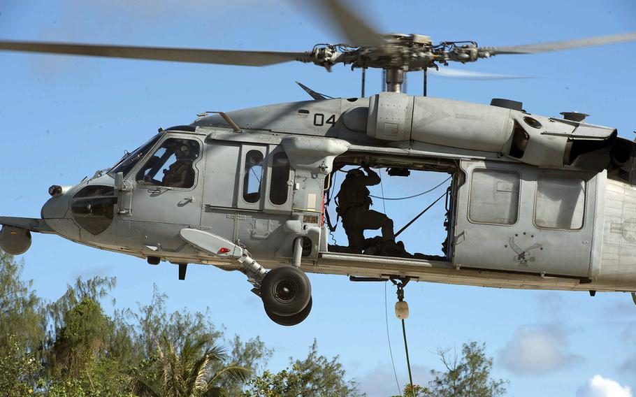 An MH-60S Seahawk from Helicopter Sea Combat Squadron 25 takes part in a torpedo recovery exercise in Polaris Point, Guam, Oct. 16, 2019.