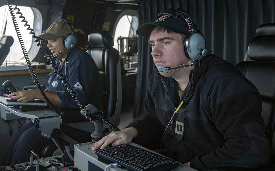 Lt. Trevor Kent stands watch on the USS Montgomery during routine operations near Johnson Reef in the South China Sea on Saturday, Jan. 25, 2020.