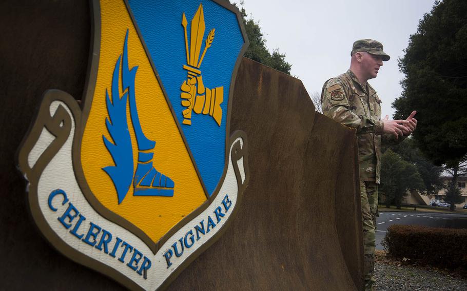 Master Sgt. Brent Fallon of the 374th Civil Engineer Squadron speaks beside a bulldozer recently displayed inside Nina Circle at Yokota Air Base, Japan, Jan. 24, 2020.