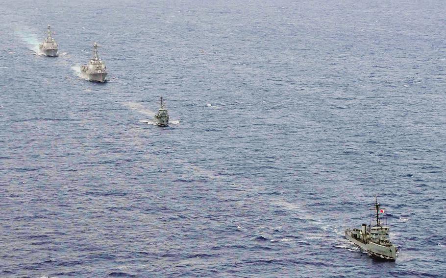 The BRP Rizal and BRP Pangasinan of the Philippine Navy train with the guided-missile destroyers USS Howard and USS Chung-Hoon during Cooperation Afloat Readiness and Training in the Philippines in 2011.