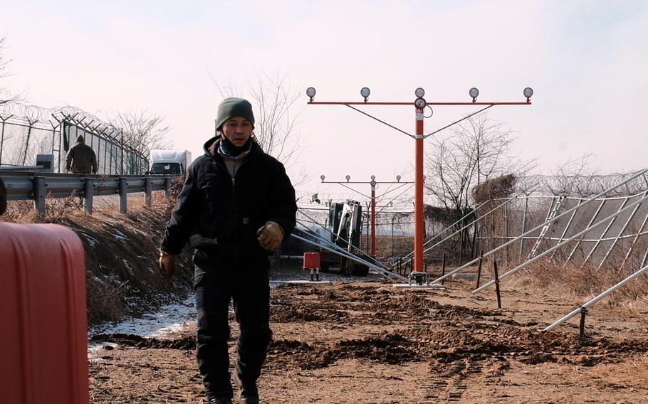 A South Korean employee of U.S. Forces Korea works at Osan Air Base, South Korea, Thursday, Feb. 6, 2020.