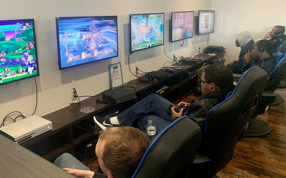 Service members make use of the gaming stations inside the newly renovated USO at Yokosuka Naval Base, Japan, Monday, Feb. 10, 2020.