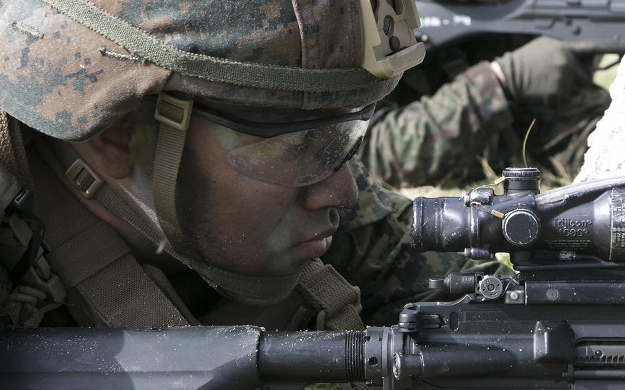 A member of the 31st Marine Expeditionary Unit serves as security following an exercise in Kin, Okinawa, Sunday, Feb. 9, 2020.