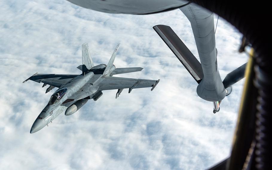 A Navy F/A-18E Super Hornet assigned to Carrier Air Wing 5 at Marine Corps Air Station Iwakuni, Japan, disconnects from a KC-135 Stratotanker while training on Jan. 10, 2020.