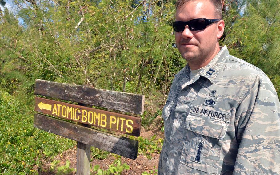 Air Force Capt. Joshua Craig, 36, a medical officer who maintained nuclear-capable cruise missiles earlier in his career, stands near the atomic bomb pits on the island of Tinian, Tuesday, Feb. 18, 2020. The site is where Fat Man and Little Boy were loaded onto the B-29 bombers that attacked Hiroshima and Nagasaki during World War II.