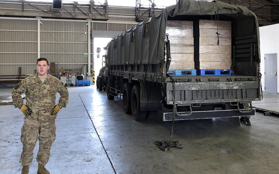 Air Force Staff Sgt. William McAtee stands by to unload a truck laden with Meals, Ready to Eat as part of Tomodachi Rescue Exercise at Yokota Air Base, Japan, Friday, Feb. 21, 2020.