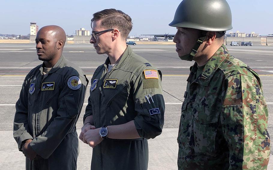 From left: Staff Sgt. Marcus Wright and Capt. Jason Le Pre of the U.S. Air Force join Capt. Hideyuki Hotsuki of the Japan Ground Self-Defense Force to speak with Japanese TV reporters during the Tomodachi Rescue Exercise at Yokota Air Base, Japan, Friday, Feb. 21, 2020.