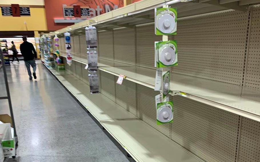 Commissary shelves that usually hold toilet paper are empty at Marine Corps Air Station Iwakuni, Japan, Sunday, March 1, 2020.